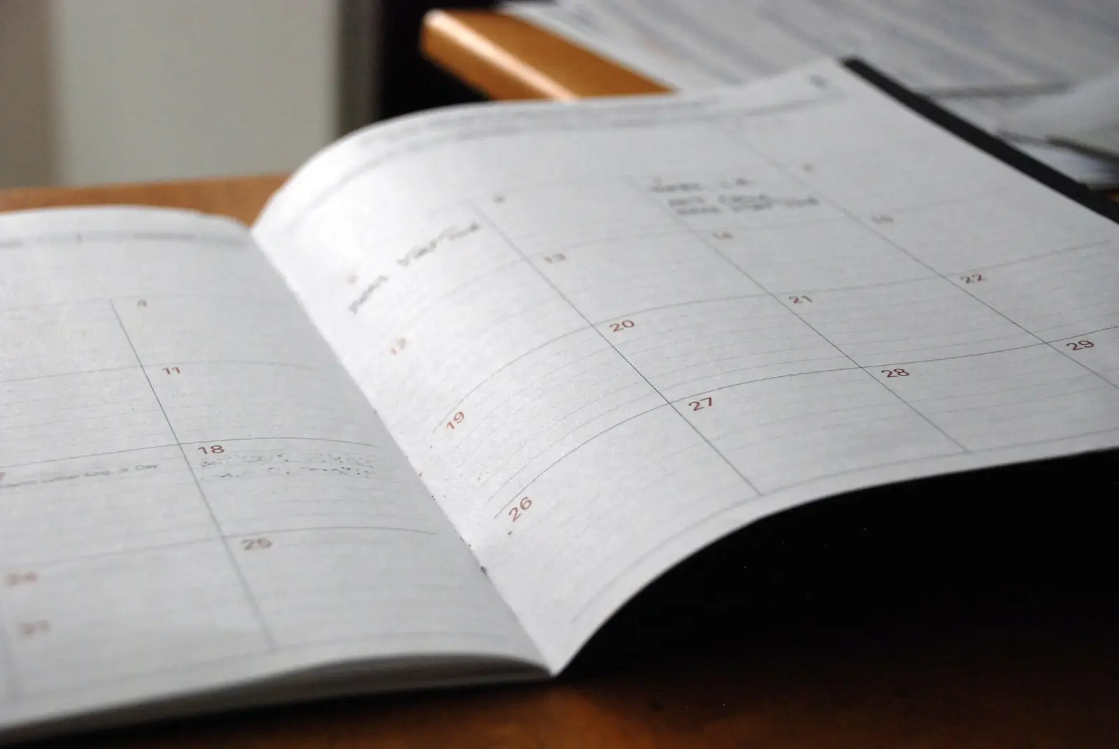 A paper calendar page on a desk