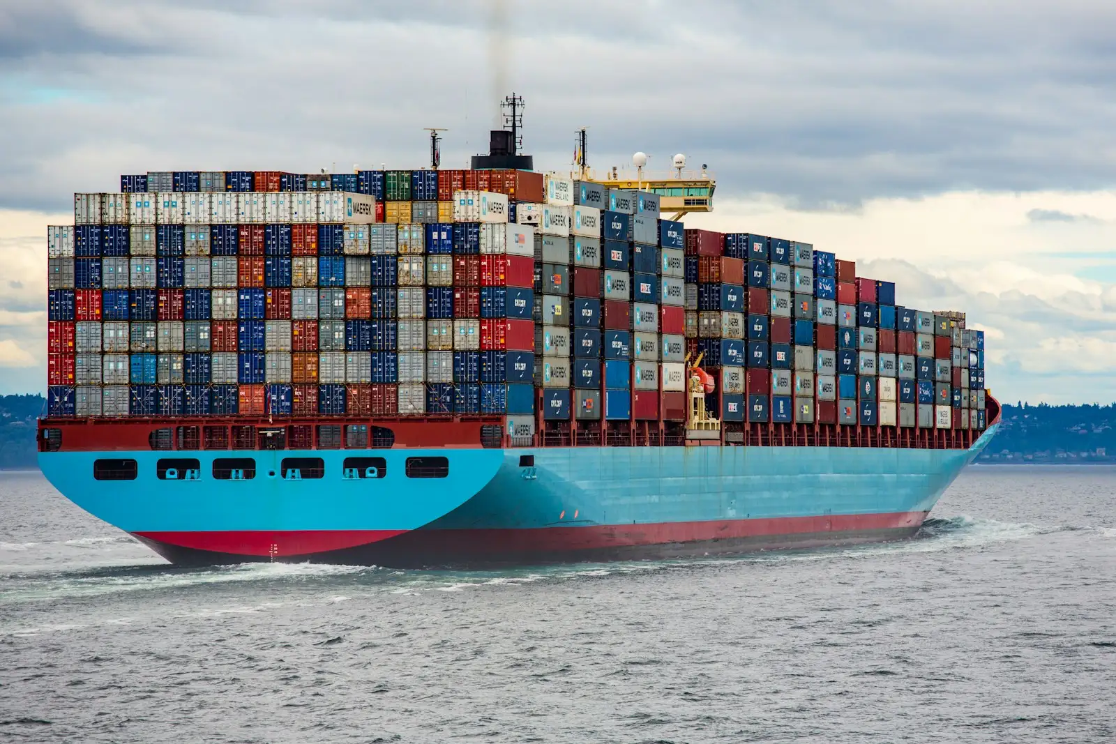 Rows of colourful stacked shipping containers at a port