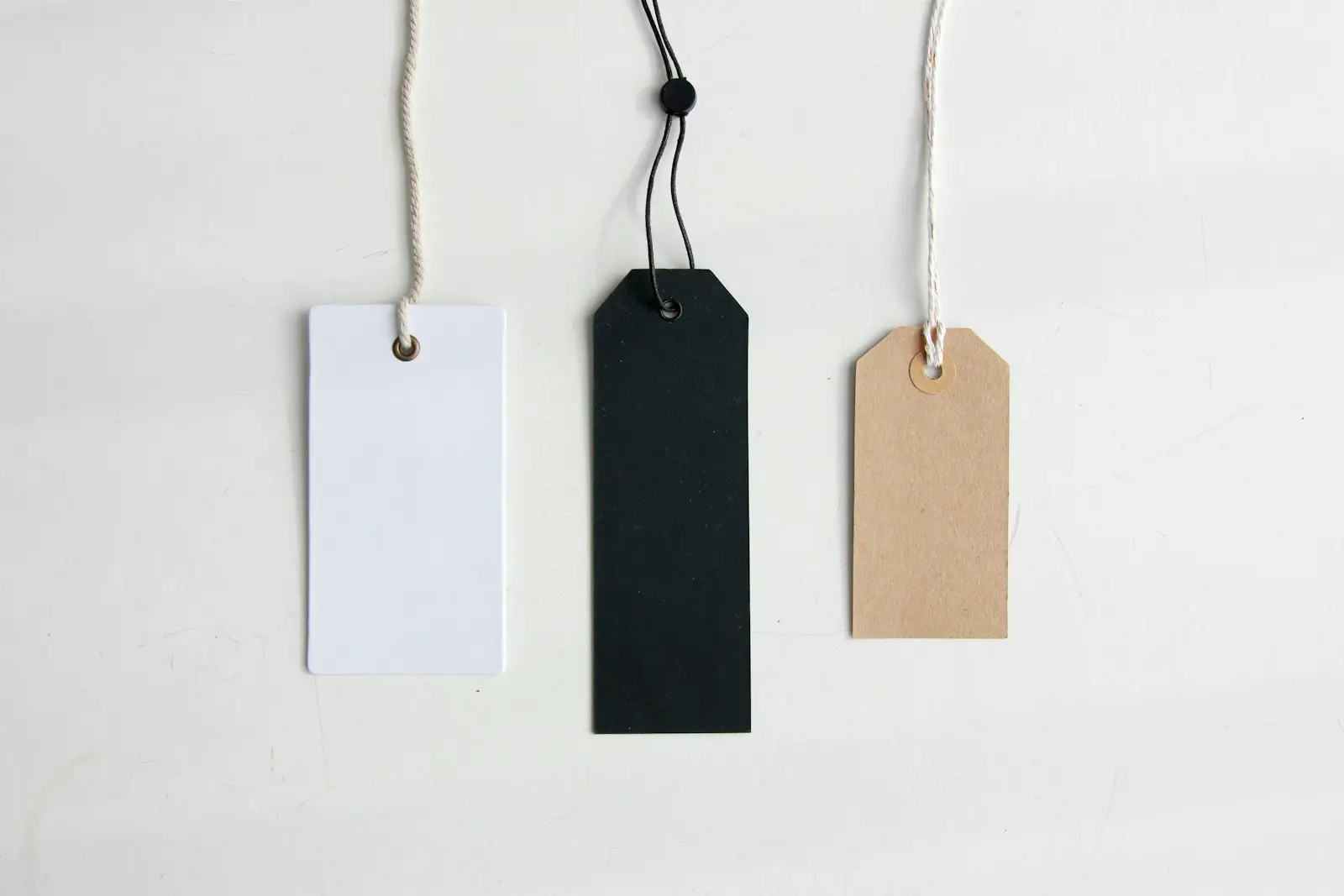 Paper price tags hanging on strings